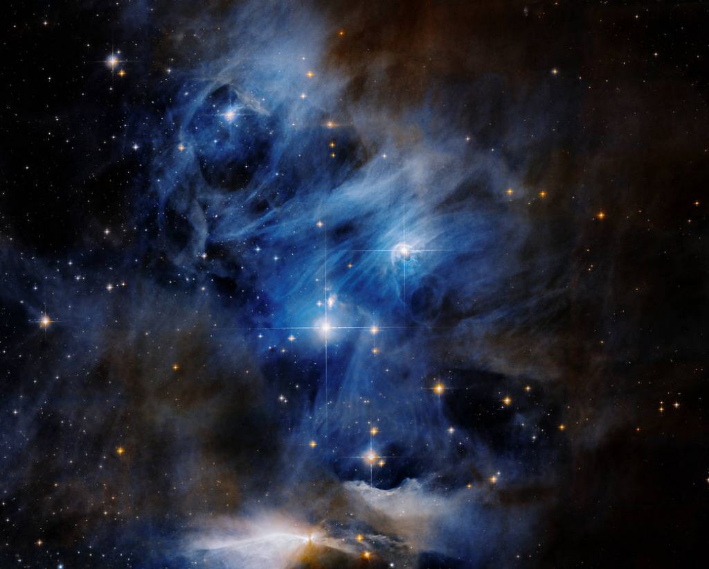 This is a Hubble composite image of the Chamaeleon I cloud complex. If Feng's hypothesis is correct, life could have originated in molecular clouds like this one. Image Credit: NASA, ESA, K. Luhman and T. Esplin (Pennsylvania State University), et al., and ESO; Processing: Gladys Kober (NASA/Catholic University of America)