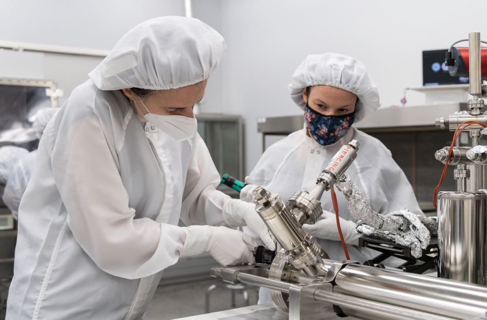 From left, Dr. Juliane Gross, Astromaterials Research and Exploration Science Division (ARES) deputy Apollo curator, and Dr. Francesca McDonald, from ESA, take precise measurements from the piercing device prior to using the newly developed tool.
Credits: NASA/James Blair