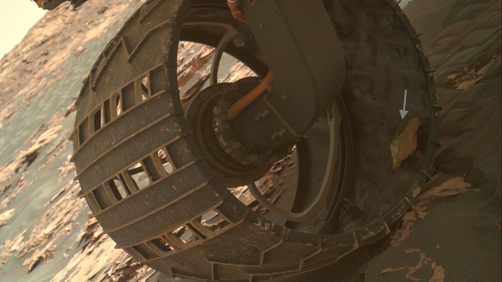 MSL Curiosity had a rock stuck in its wheel in June 2017. Image Credit: NASA/JPL-Caltech
