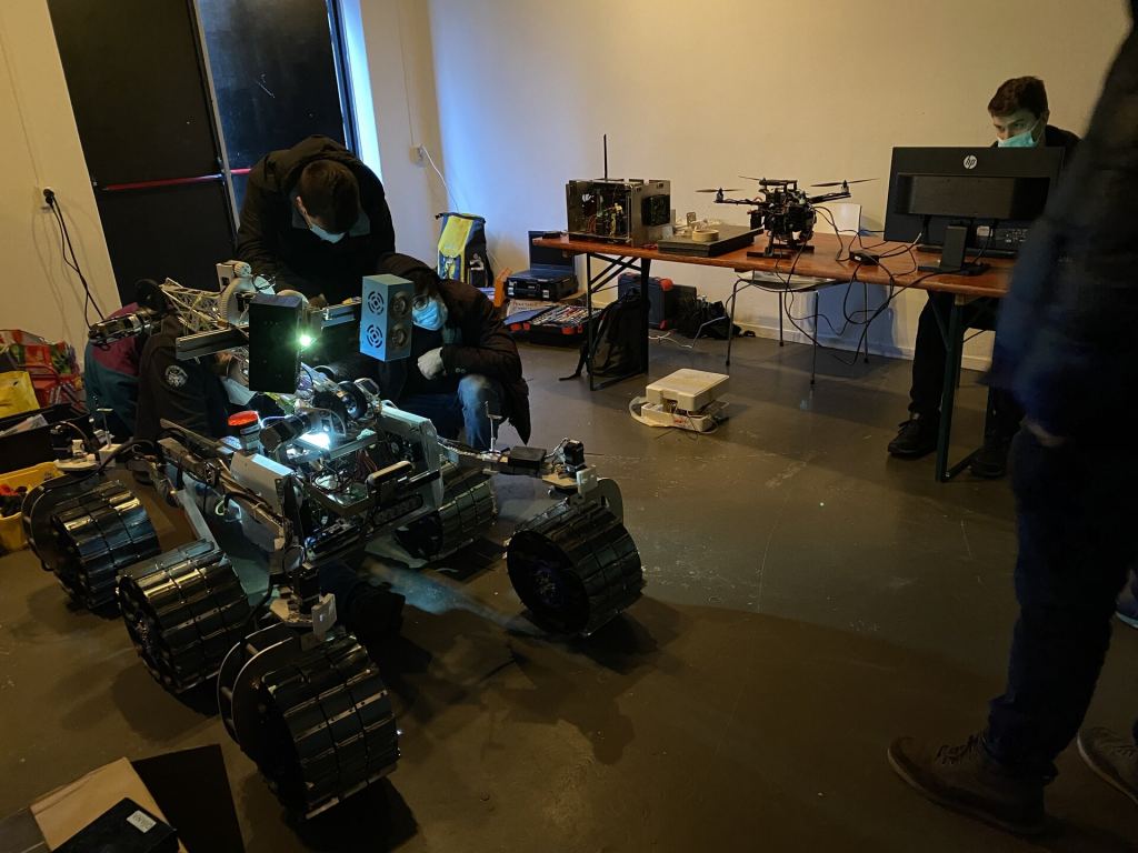 The University of Turin team prepares their rover for the inaugural ESA-ESRIC Space Resources Challenge. Image Credit: ESA-M. Sabbatini