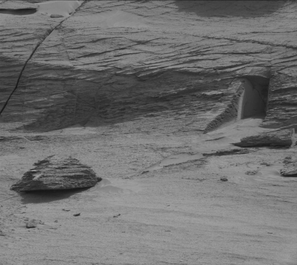 A Mastcam image from the Mars Curiosity rover captures what looks like a doorway into a rock ledge. It was formed when layered rock cracked and eroded away.  Courtesy NASA Mars Curiosity Rover team.