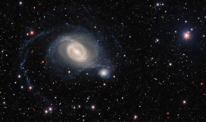 The interacting galaxy pair NGC 1512 and NGC 1510 take center stage in this image from the Dark Energy Camera, a state-of-the art wide-field imager on the Víctor M. Blanco 4-meter Telescope at Cerro Tololo Inter-American Observatory