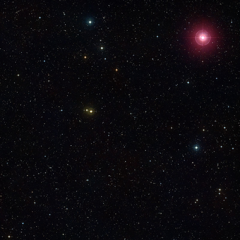 Variable star Mira (upper right red star) varies in brightness over a period of more than 100 days. It's a pulsating red giant, and will eventually become a planetary nebula. Courtesy ESO and the Digital Sky Survey. 