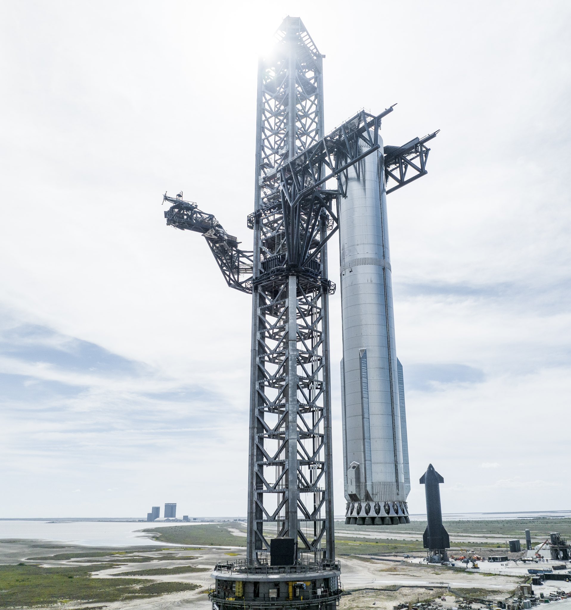 Mechazilla Lifts a Super Heavy With all 33 Engines Onto the Launchpad