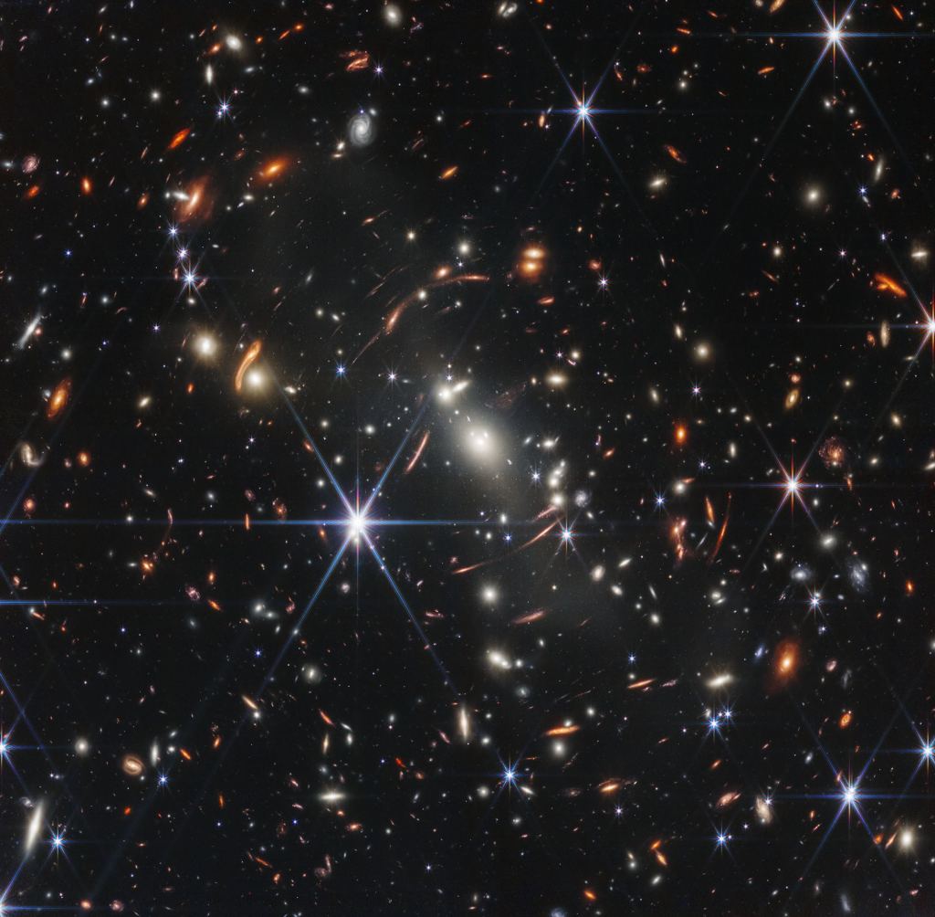 The galaxy cluster SMACS 0723 as seen by NIRCam on JWST (Not part of PEARL.) Its gravitational lensing properties (from its mass and from the mass of dark matter) are helping astronomers identify 88 distant galaxies in this field of view for further study. These distant galaxies are the most ancient and are critical to understanding how the Universe takes the shape it does today. JWST images like this also show evidence of dark matter, another question waiting for an answer. Courtesy NASA, ESA, CSA, STScI