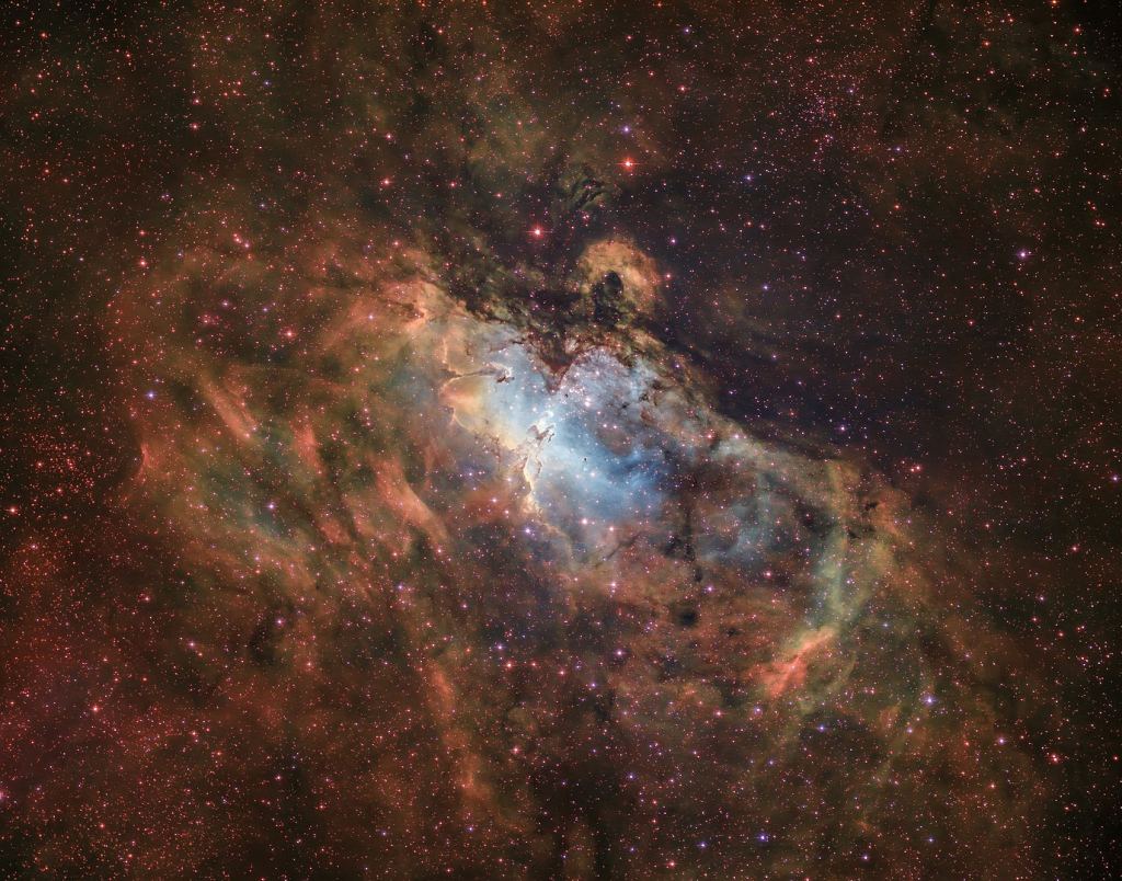 This image shows the Eagle Nebula's wider structure. The Pillars of Creation are right in the center. An amateur astronomer captured it from the Israeli desert. Image Credit: By David (Deddy) Dayag - Own work, CC BY-SA 4.0, https://commons.wikimedia.org/w/index.php?curid=106472752