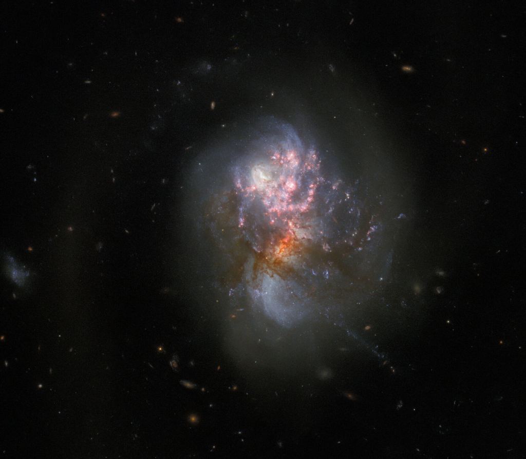 Webb and Hubble Peer Into the Wreckage of a Galactic Collision