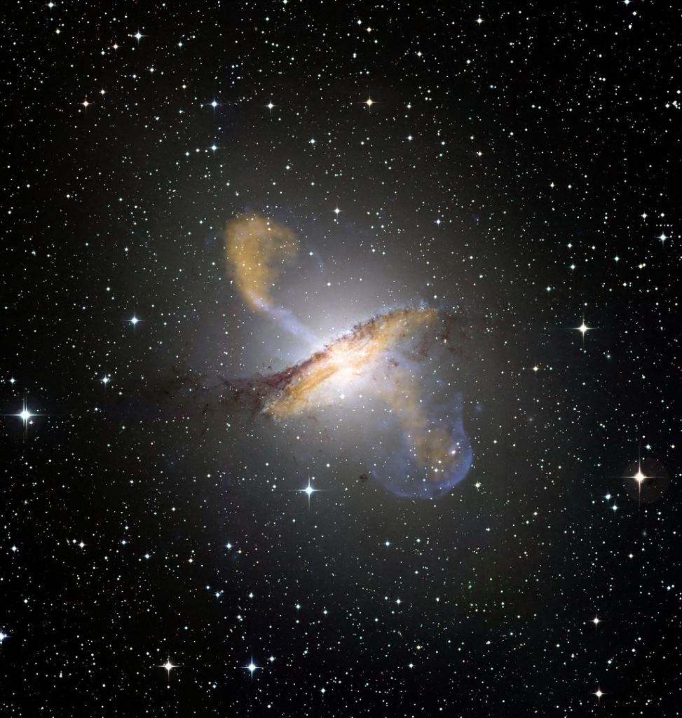 The Universe is full of galaxies whose shape has been changed by interactions and mergers.  This is Centaurus A, a bar galaxy that merged with a spiral galaxy about 300 million years ago.  The merger created the dark dust cloud, which is not a feature of elliptical galaxies.  The merger created a spiral of gas in the core of Centaurus A. Image Credit: ESA