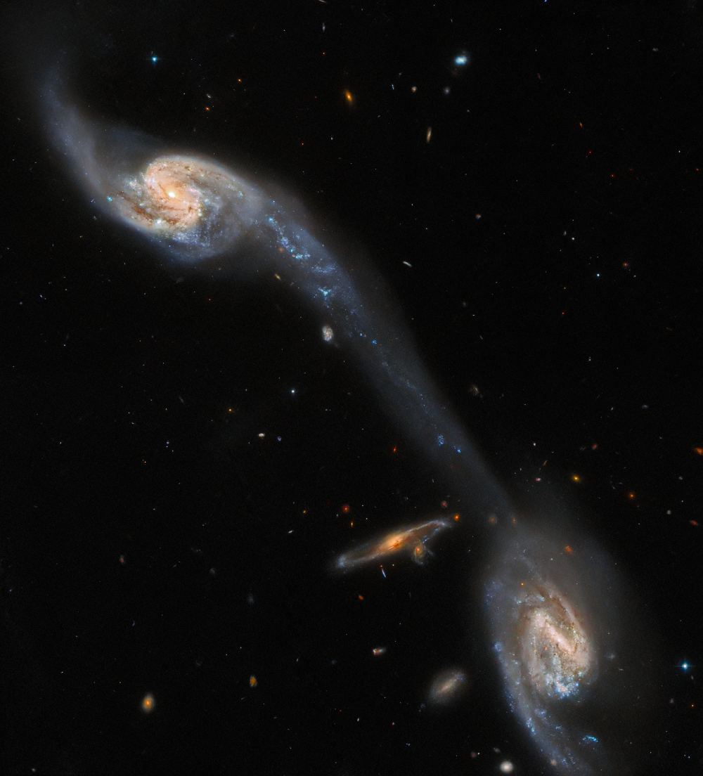 The Perfect Tidal Tail Connects These two Galaxies Seen by Hubble