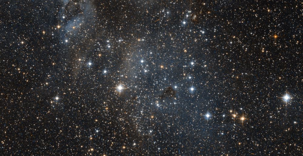 Another image of NGC 1858 with less colour processing. This more closely resembles the cluster in its "natural" state. Image Credit: NASA/ESA