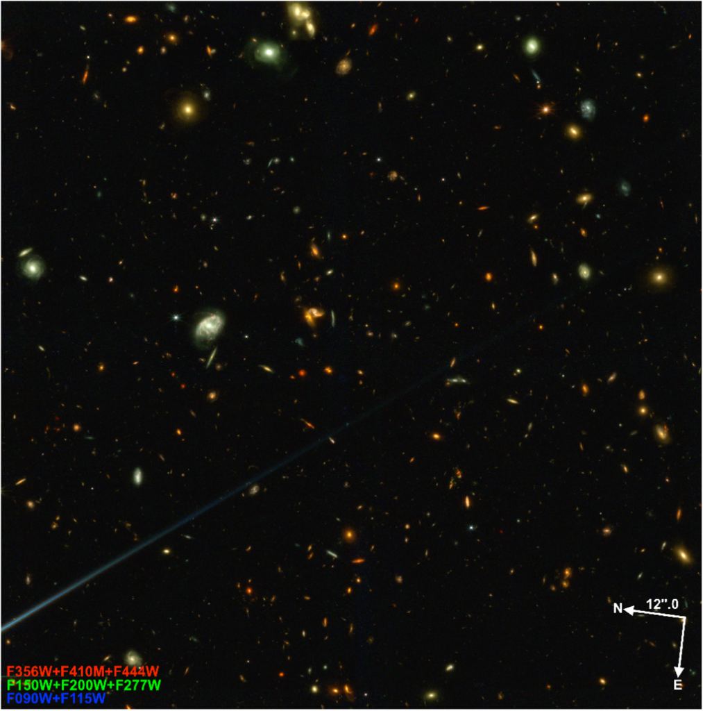 This image is of the El Gordo cluster, a cluster of galaxies chosen for its enormous mass. This image doesn't show the center of the cluster, but it has a "rich collection of distant lensed source candidates," according to the authors. STScI/Windhorst et al. 2023.