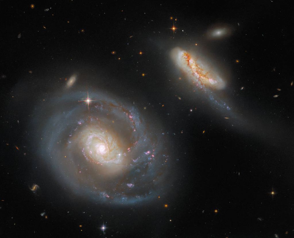 This striking image from the NASA/ESA Hubble Space Telescope showcases Arp 298, a stunning pair of interacting galaxies. Arp 298 — which comprises the two galaxies NGC 7469 and IC 5283 — lies roughly 200 million light-years from Earth in the constellation Pegasus. Image Credit: ESA/Hubble & NASA, A. Evans, R. Chandar
