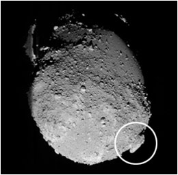This image from JAXA's Hayabusa spacecraft shows a boulder on Itokawa's surface. Hayabusa's images were the first to show the existence of rubble pile asteroids. JAXA scientists wrote: "This is a very important clue to studying the asteroid's formation history. It is safe to assume that a larger celestial body originally existed before Itokawa. And on its destruction, a fragment from it became Itokawa as other finer fragments piled on the asteroid surface." Image Credit: JAXA