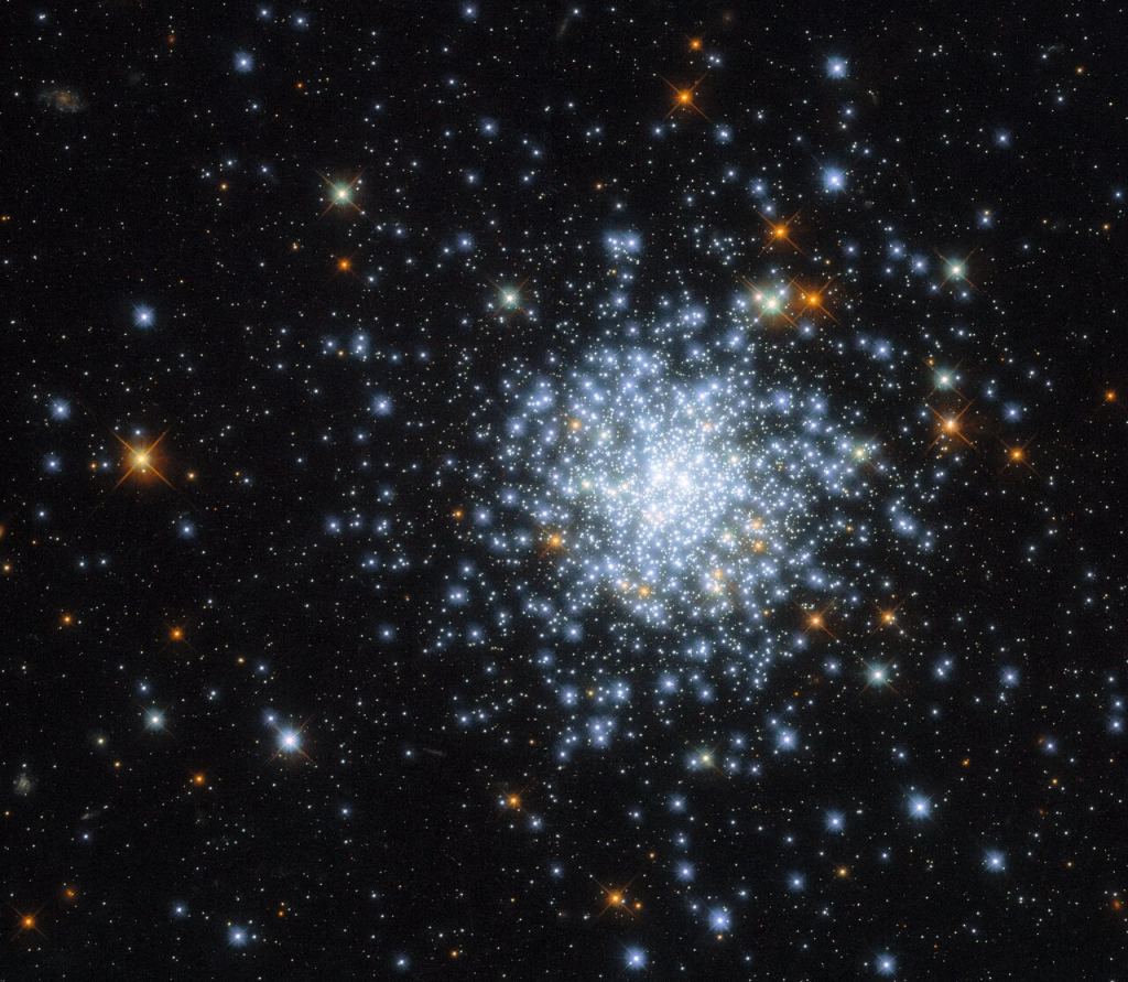 This is an open cluster known as NGC 2164. It's located within one of the Milky Way galaxy's closest neighbours — the satellite galaxy known as the Large Magellanic Cloud. The Large Magellanic Cloud is home to roughly 700 open clusters alongside about 60 globular clusters. This image of NGC 2164 was taken by the NASA/ESA Hubble Space Telescope's Wide Field Camera 3 (WFC3), which has previously imaged many other open clusters, including NGC 330 and Messier 11. Image Credit: ESA/Hubble & NASA, J. Kalirai, A. Milone