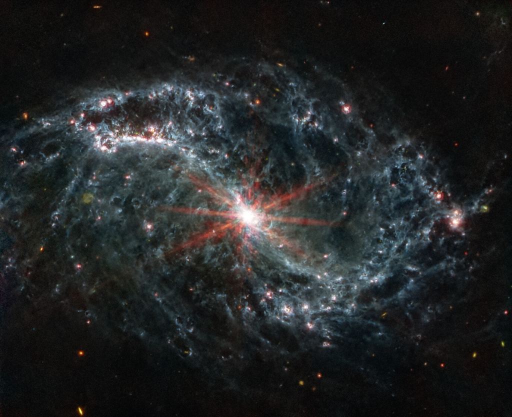 This is NGC 7496, another spiral galaxy in the PHANGS project. The active galactic nucleus shines brightly in this image as the super-massive black hole accretes material. Image Credit: NASA, ESA, CSA, and J. Lee (NOIRLab), A. Pagan (STScI) 
