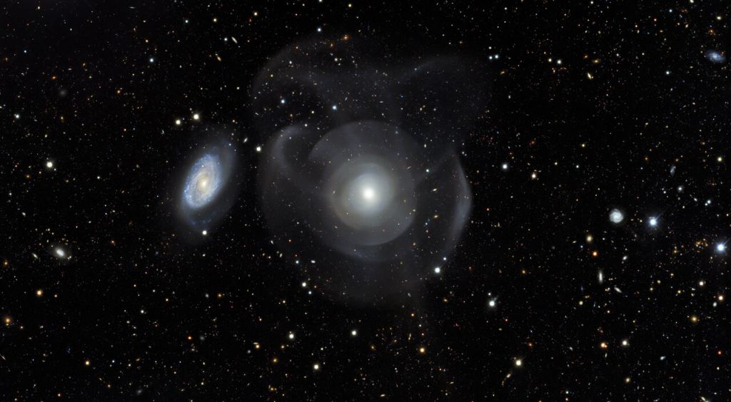 This image of both distant and nearby galaxies is an excerpt from the Dark Energy Survey, which has released a massive, public collection of astronomical data and calibrated images from six years of work. It was taken with the Dark Energy Camera  on the Víctor M. Blanco 4-meter Telescope.  Credit: DES/DOE/Fermilab/NCSA & CTIO/NOIRLab/NSF/AURA  Acknowledgments: Image processing: DES, Jen Miller (Gemini Observatory/NSF's NOIRLab), Travis Rector (the University of Alaska Anchorage), Mahdi Zamani & Davide de Martin