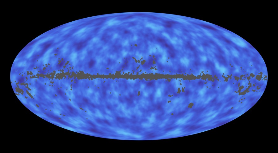 A full-sky map from the Planck mission shows matter as seen from Earth out to the limits of the observable Universe. Regions with less mass show up as lighter areas while those with more mass are darker. Courtesy ESA/Planck Mission.