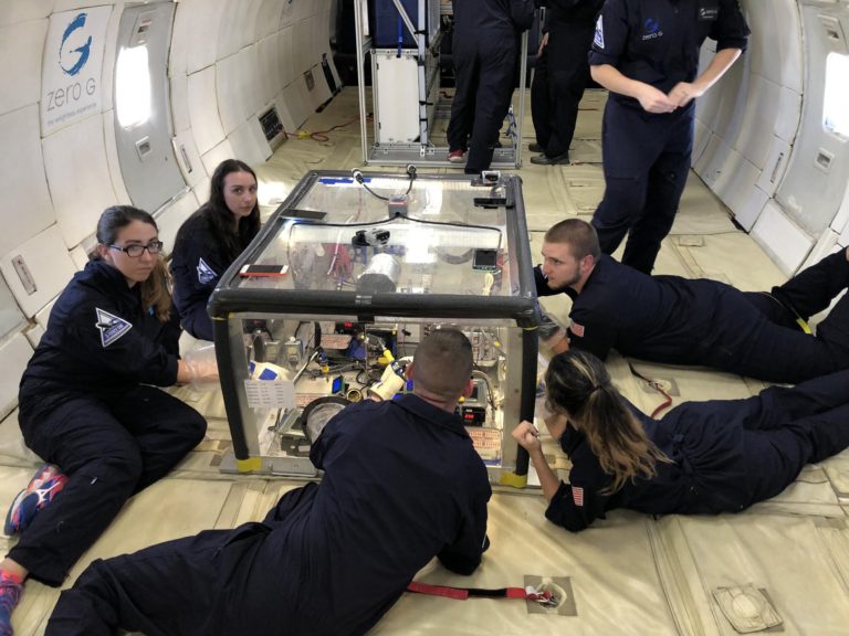 WVU students in flight preparation onboard the G-FORCE ONE (Zero-Gee) in a suborbital flight to test materials for on-orbit electronics repair. Photo by Dr. John Kuhlman.