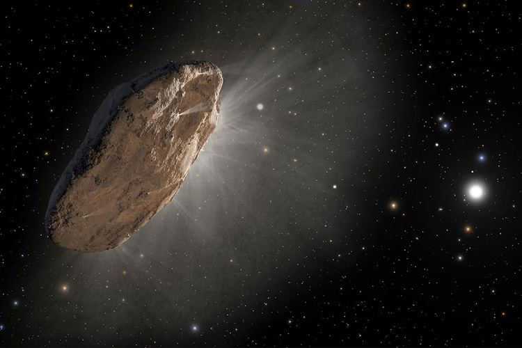 An artist’s depiction of the interstellar comet ‘Oumuamua, as it warmed up in its approach to the sun and outgassed hydrogen (white mist), which slightly altered its orbit. The comet, which is most likely pancake-shaped, is the first known object other than dust grains to visit our solar system from another star. (Image credit: NASA, ESA and Joseph Olmsted and Frank Summers of STScI)