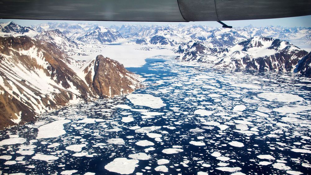 An aerial view of the icebergs near Kulusuk Island, off the southeastern coastline of Greenland, a region that is exhibiting an accelerated rate of ice loss. The water runs off into the ocean and is contributing to sea level rise. Credits: NASA Goddard Space Flight Center