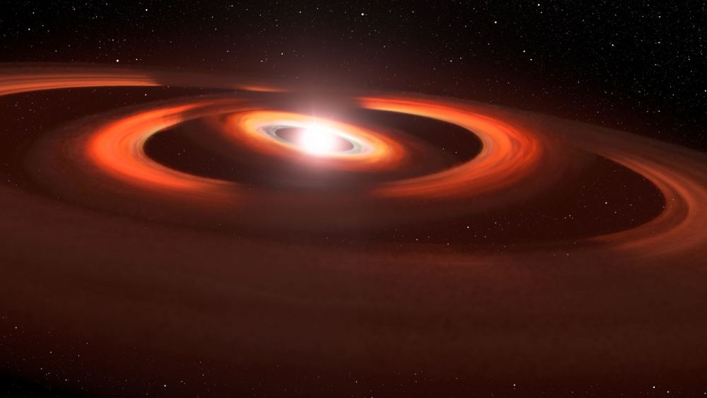 This artist's concept is based on Hubble Space Telescope images of gas-and-dust disks around the newborn star TW Hydrae. HST images show shadows sweeping across the disks encircling the system. These shadows are probably from slightly inclined inner disks that block starlight from reaching the outer disk. The disks are slightly inclined to each other due to the gravitational pull of unseen planets warping the disk structure. Credits ARTWORK: NASA, AURA/STScI for ESA, Leah Hustak (STScI)