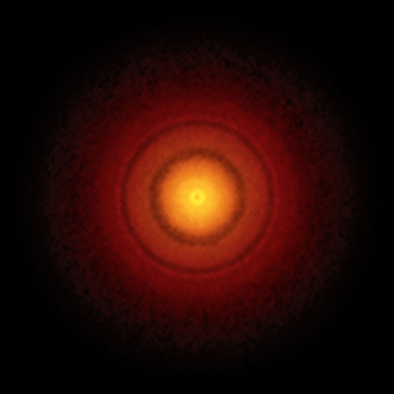 Imagen de ALMA del disco planetario alrededor de la estrella recién nacida TW Hydrae.  Revela los anillos y huecos clásicos que significan que los planetas se están formando en este sistema.