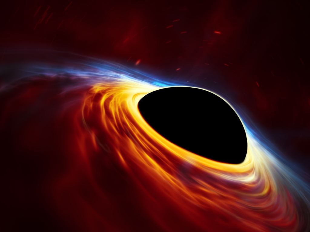 This artist's impression depicts a rapidly spinning supermassive black hole surrounded by an accretion disc. When black holes consume a lot of disc material quickly, it can cause a quasar. Credit: ESO, ESA/Hubble, M. Kornmesser