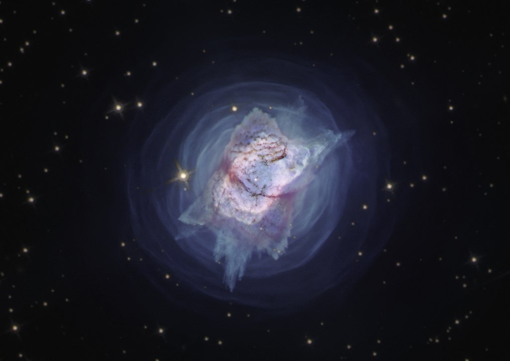 This image from the NASA/ESA Hubble Space Telescope depicts NGC 7027, or the "Jewel Bug" nebula. The object had been slowly puffing away its mass in quiet, spherically symmetric or perhaps spiral patterns for centuries — until relatively recently when it produced a new cloverleaf pattern. New observations of the object have found unprecedented levels of complexity and rapid changes in the jets and gas bubbles blasting off of the star at the centre of the nebula. Image Credit: By ESA/Hubble, CC BY 4.0, https://commons.wikimedia.org/w/index.php?curid=91369915