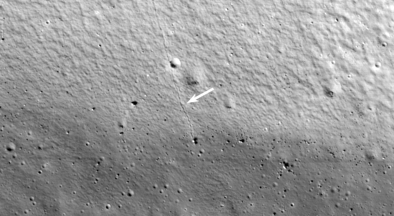 This is a portion of one of ShadowCam’s first images from lunar orbit on the permanently shadowed wall and floor of Shackleton crater, which is found near the South Pole. The arrow marks the track of a boulder that rolled down the crater wall. The observation of these trails helps scientists characterize the boulder shape and velocity and regolith features, furthering our understanding of the geotechnical properties of the Moon. The trail is several hundred meters long. Courtesy: NASA/KARI/ASU