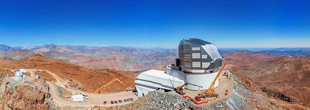 Underneath the clear blue sky of Cerro Pachón ridge in Chile, construction continues on the Vera C. Rubin Observatory. The 8.4-meter telescope is equipped with a 3.2-gigapixel camera — the world's largest digital camera ever fabricated for optical astronomy — and is expected to see its first light at the end of 2024. It will conduct an unprecedented, decade-long survey of the optical sky called the Legacy Survey of Space and Time (LSST). New research shows how the LSST can successfully detect binary black holes, a difficult thing to do. Image Credit: NOIRLab/Vera Rubin Observatory.