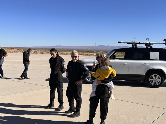 Just after landing, Kellie Gerardi (left), Alan Stern (center), and space tourist Kettie Maisonrouge (right), talked about their experience during the Virgin Galactic flight. Image credit: Carolyn Collins Petersen