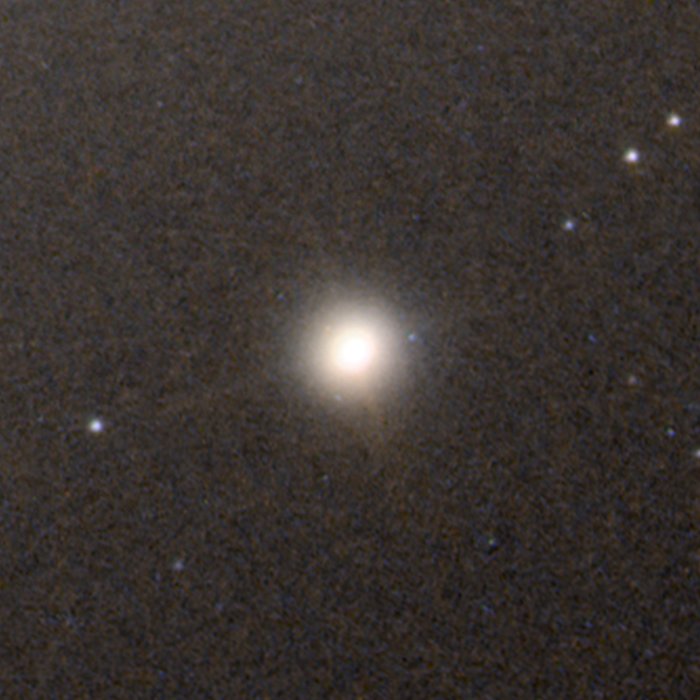 The Ultra Compact Dwarf Galaxy M60-UCD1 is not ancient and is only about 50 million light years away. But it's similar to the ancient dwarf galaxies found by the JWST. It's only about 1/500th the diameter of the Milky Way, yet is densely packed with stars and extremely luminous. (Image Credit NASA/ESA and A.Seth) 