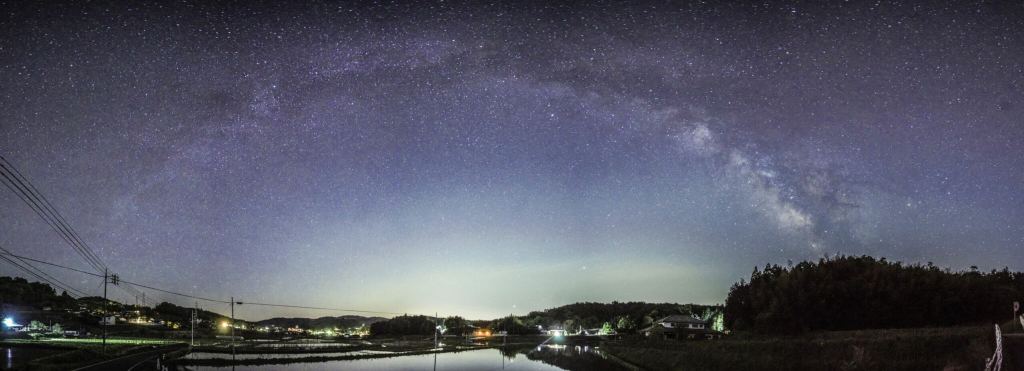 The arch of the Milky Way seen over Bisei Town in Japan. It prides itself on its dark skies, but faces scattered light pollution from other nearby municipalities. Courtesy DarkSky.Org.