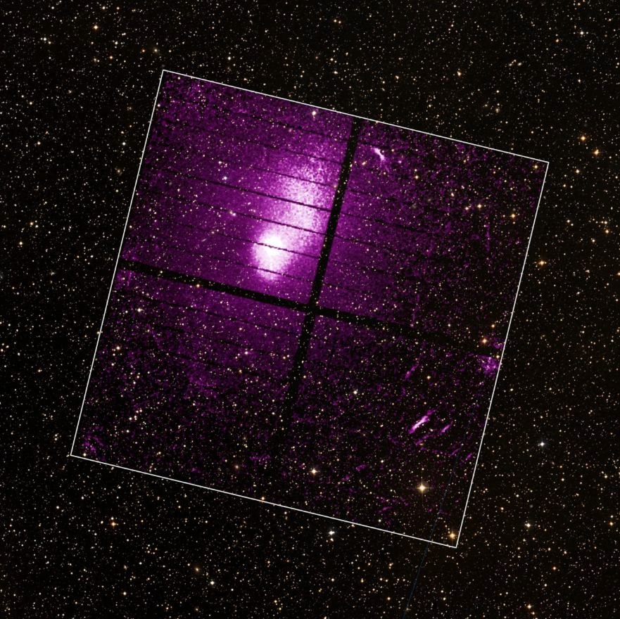 XRISM's Xtend instrument captured galaxy cluster Abell 2319 in X-rays, shown here in purple and outlined by a white border representing the extent of the detector. The background is a ground-based image showing the area in visible light. The pink is X-ray light from gas that permeates the cluster heated to millions of degrees. By measuring it with XRISM, astronomers can measure the mass of the entire cluster, an important point in understanding it. Image Credit: JAXA/NASA/XRISM Xtend; background, DSS