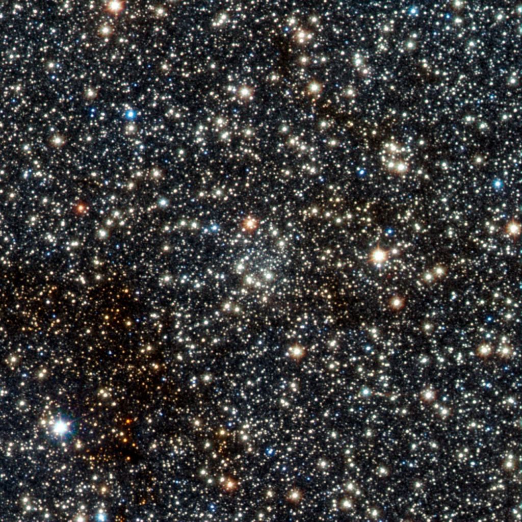 This image from VISTA shows the faint newly found globular star cluster VVV CL002. This globular, which appears as an inconspicuous concentration of faint stars near the centre of the picture, lies close to the centre of the Milky Way and is moving closer to the centre. The region is crowded with stars. Image Credit: ESO/D. Minniti/VVV Team