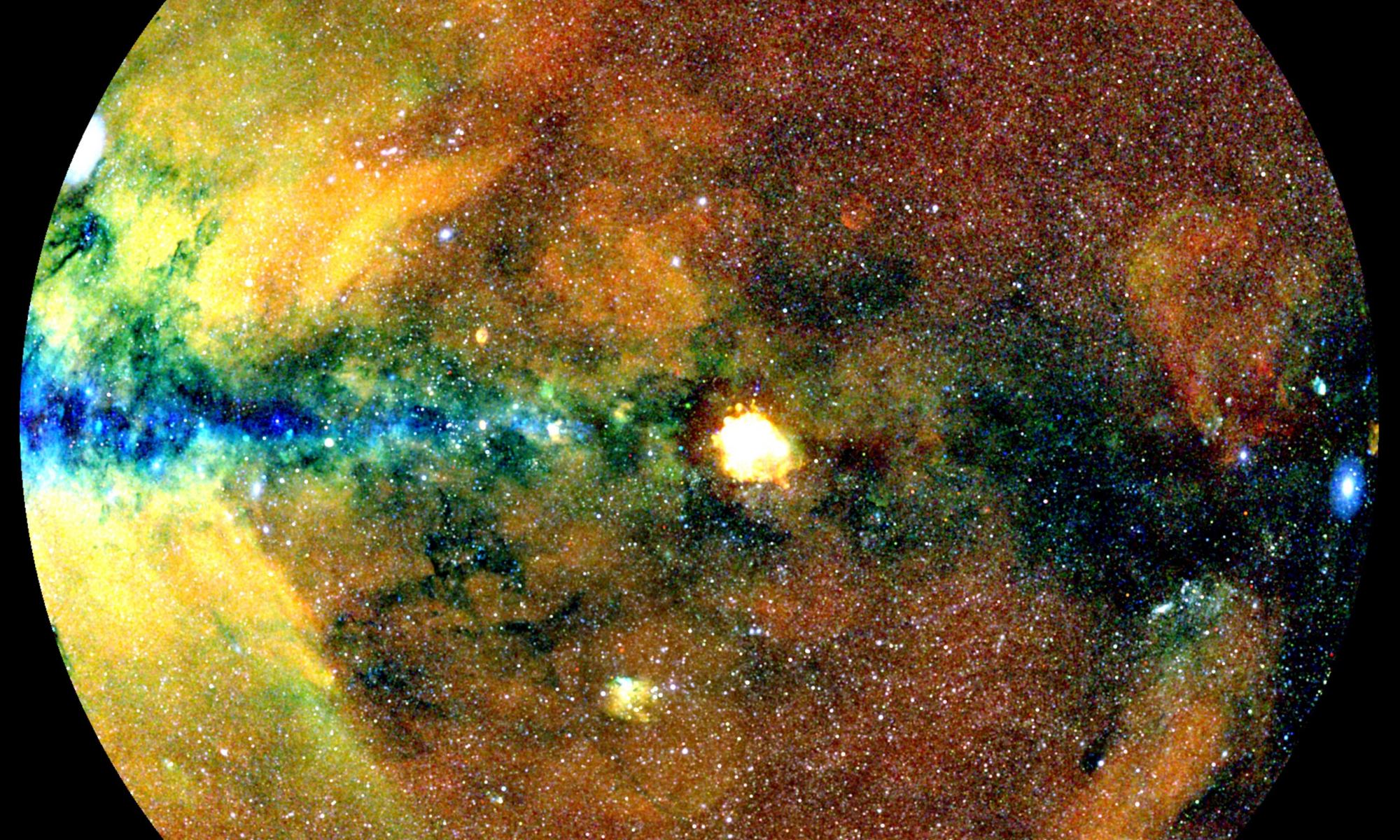 This image show half of the X-ray sky, projected onto a circle with the center of the Milky Way on the left and the galactic plane running horizontally. Photons have been colour-coded according to their energy (red for energies 0.3-0.6 keV, green for 0.6-1 keV, blue for 1-2.3 keV). Credit: MPE, J. Sanders for the eROSITA consortium