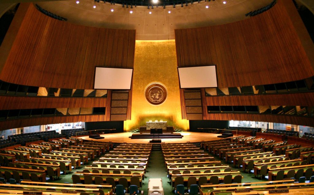 This is the United Nations General Assembly. Are we united enough to constrain AI? Image Credit: By Patrick Gruban, cropped and downsampled by Pine - originally posted to Flickr as UN General Assembly, CC BY-SA 2.0, https://commons.wikimedia.org/w/index.php?curid=4806869