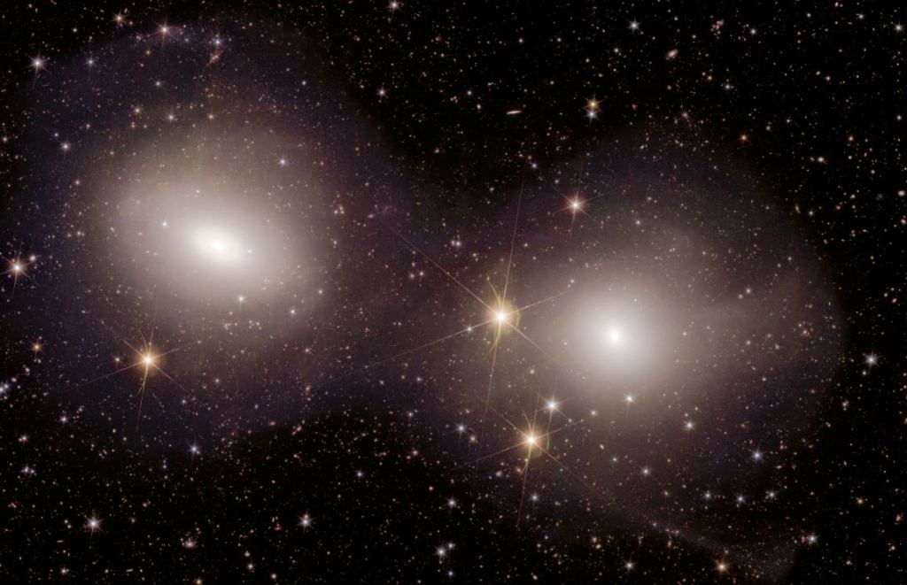 This zoom-in shows a pair of interacting galaxies in the Dorado Group. Tidal tails of stars are visible as wispy streams near the right and bottom right of the right-side galaxy. Image Credit: ESA/Euclid/Euclid Consortium/NASA, image processing by J.-C. Cuillandre (CEA Paris-Saclay), G. Anselmi. LICENCE: ESA Standard Licence