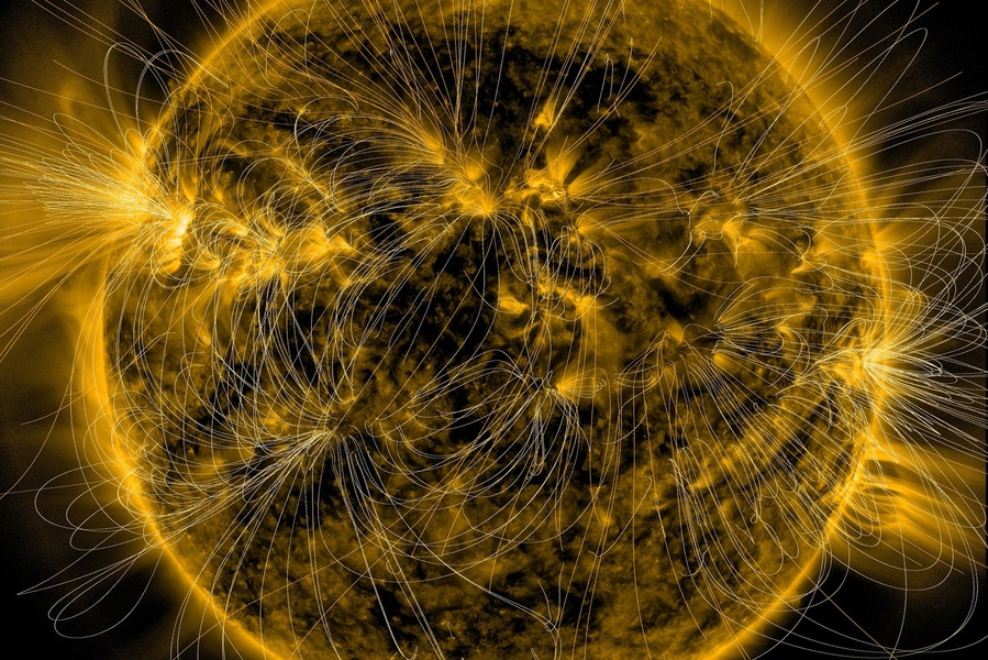 A new study suggests sunspots and solar flares could be generated my a magnetic field within the Sun's outermost layers. This shows the Sun's magnetic fields overlaying an image from the Solar Dynamics Observatory. NASA/SDO/AIA/LMSAL